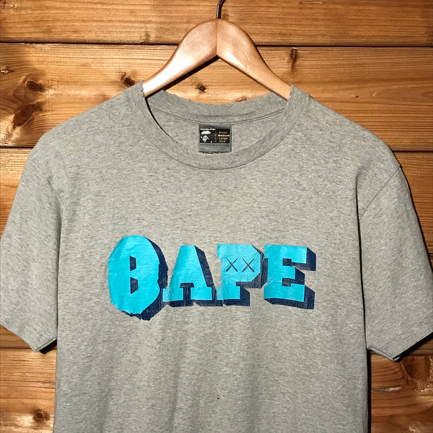 Bape, A Bathing Ape x Kaws Spellout t shirt