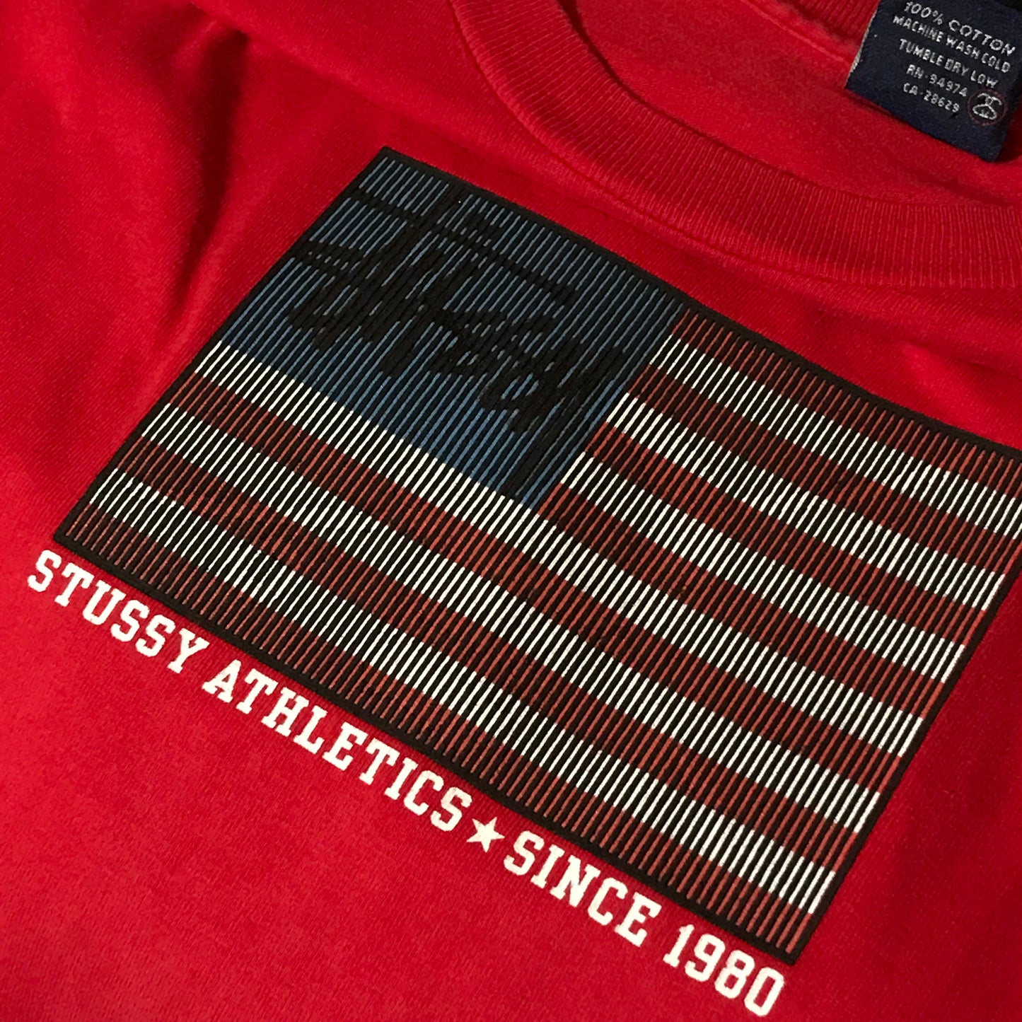 90s Stüssy Athletics Jolly Rodger USA Flag t shirt