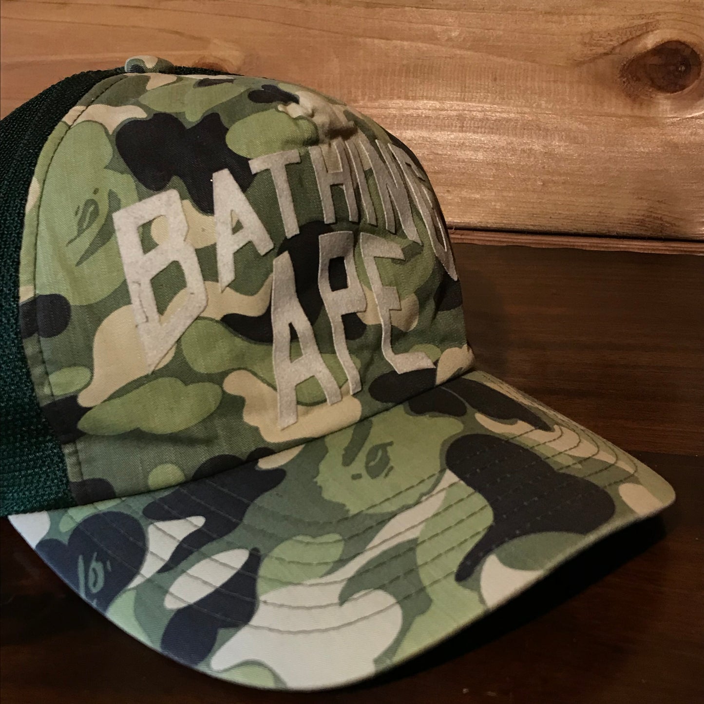 Bape, A Bathing Ape Arc Spellout Green Camo trucker cap