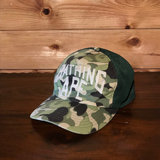 Bape, A Bathing Ape Arc Spellout Green Camo trucker cap